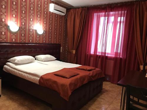 Un ou plusieurs lits dans un hébergement de l'établissement Felisa Hotel