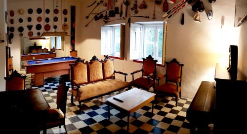 a living room with couches and a pool table at La Casa De Las Bicicletas in Cazorla