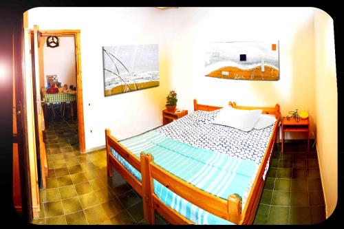 a bedroom with a bed in a room at Casa "Il Girasole" in Stintino
