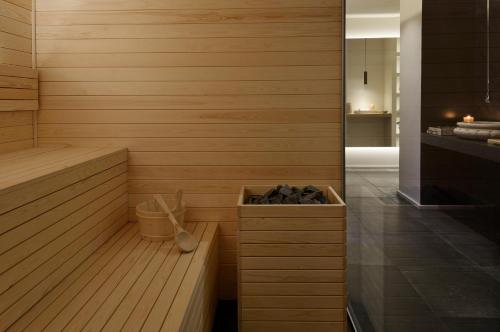 a sauna with a box of shoes in it at Relais Rossar Boutique Hotel Garda & Hills in Costermano sul Garda