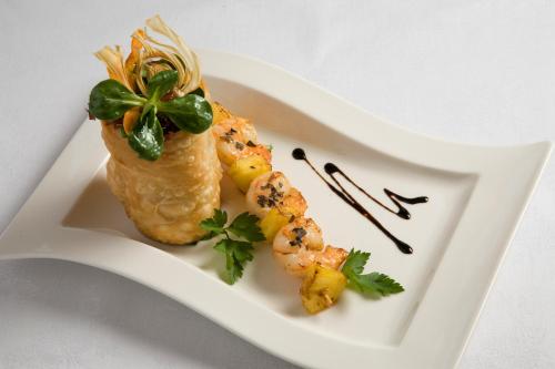 a plate of food with shrimp on a white plate at Hotel Wachau in Melk