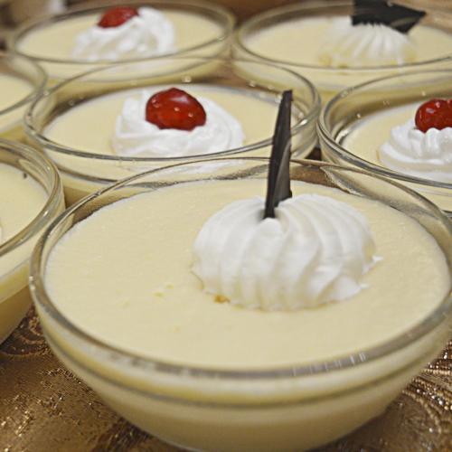 a glass bowl filled with whipped cream and a cherry on top at Argentino Hotel Casino & Resort in Piriápolis