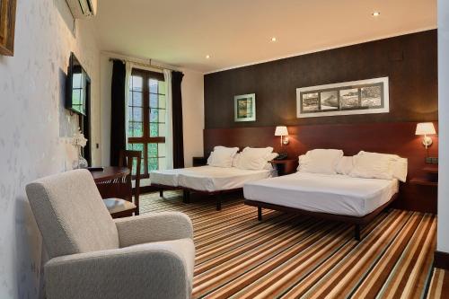 Posteľ alebo postele v izbe v ubytovaní Hotel Granda