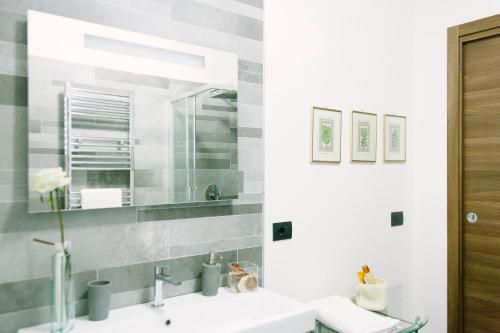 a bathroom with a sink and a mirror at Villa Amalia in Avellino