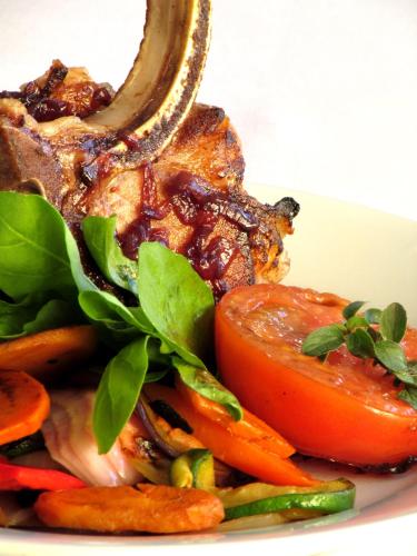 a plate of food with meat and vegetables at Argentino Hotel Casino & Resort in Piriápolis