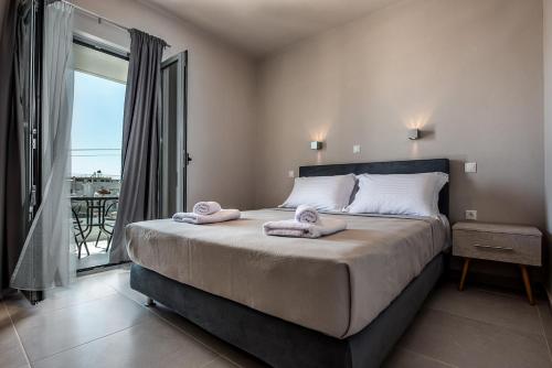 Postel nebo postele na pokoji v ubytování Asteri Apartments und Studios