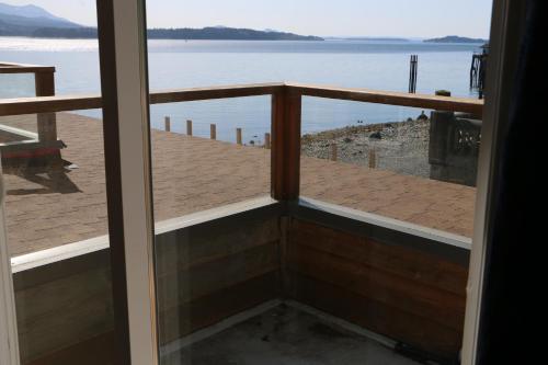 a view of a balcony with a view of the water at Nimpkish Hotel in Alert Bay