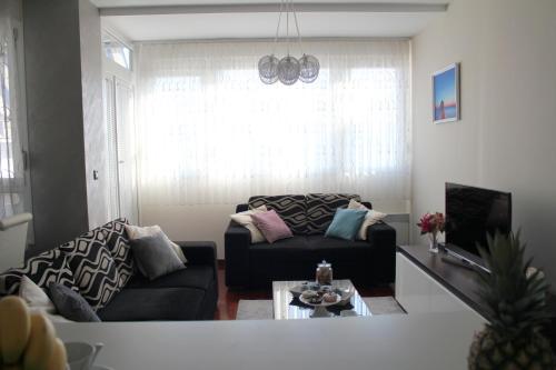 a living room with a couch and a table at Beautiful and luxury apartment in Split centre in Split