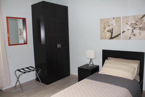 Postel nebo postele na pokoji v ubytování B&B Il Giardino In Città - Parcheggio Privato Gratuito