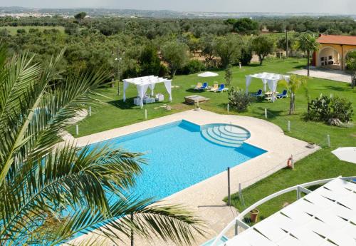 an overhead view of a swimming pool in a resort at Masseria La Baronessa Resort in Tuglie