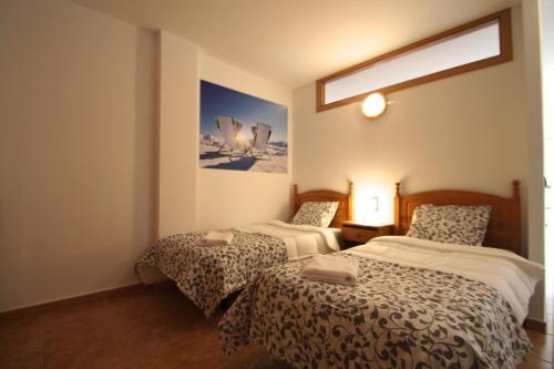 A bed or beds in a room at Pont de Toneta 2,6 Ransol, Zona Grandvalira