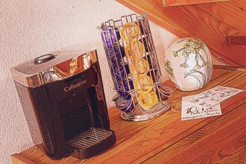 a shelf with a group of vases on a wall at U Svatého Petra in Kájov