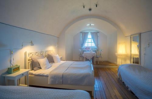 Säng eller sängar i ett rum på Kastellet Bed & Breakfast