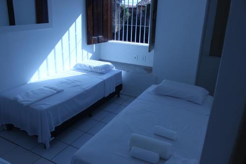 เตียงในห้องที่ Hotel Pousada Catarina Mina