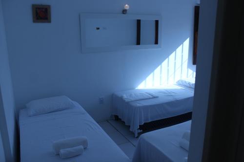 Hotel Pousada Catarina Mina房間的床