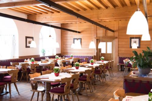 a large dining room with tables and chairs at Maria Waldrast in Matrei am Brenner