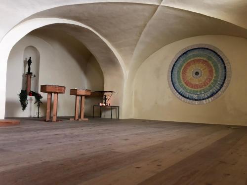an empty room with a painting on the wall at Maria Waldrast in Matrei am Brenner