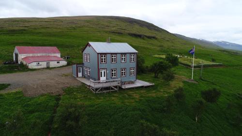 an aerial view of a house in a field at Saudafell Guesthouse in Sauðafell