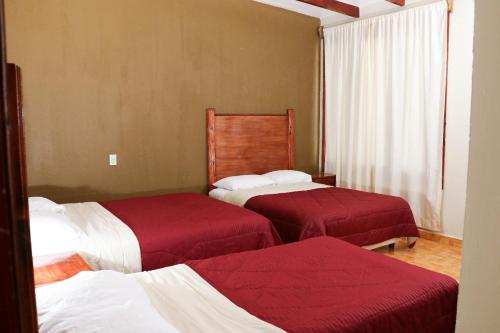 Кровать или кровати в номере Hotel La Gloria Xilitla