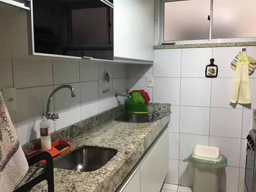 a kitchen with a sink and a counter top at Condomínio Palm Beach in Aquiraz