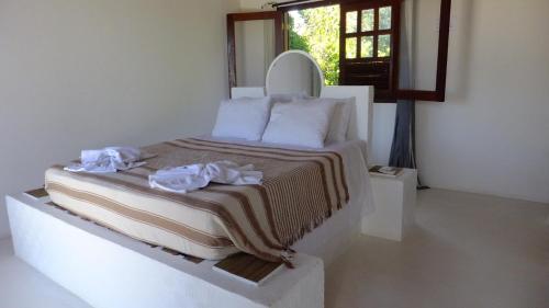 Ένα ή περισσότερα κρεβάτια σε δωμάτιο στο Condomínio Mar Aberto