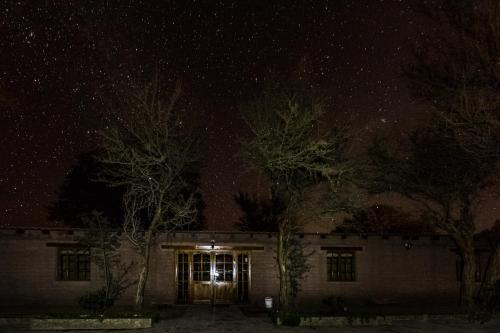 a house at night with a starry sky at Hotel Casa Don Esteban in San Pedro de Atacama