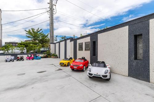 a group of cars parked next to a building at Han Tian Slide in Wujie