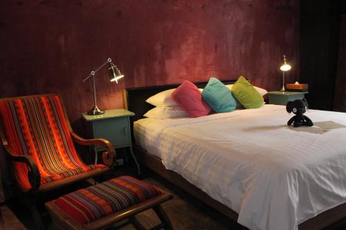 Villa Thapae tesisinde bir odada yatak veya yataklar