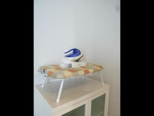 a table with a blender on top of a stool at Nagoya Motoyama House C in Nagoya