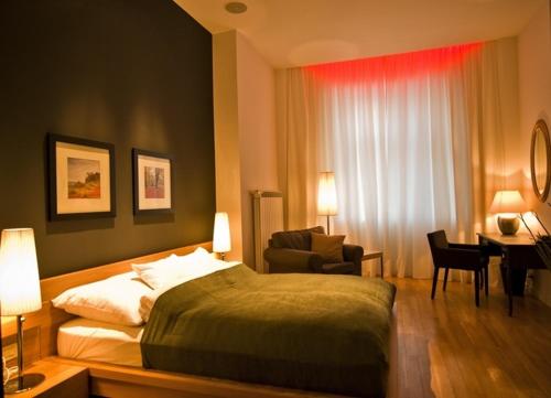 A bed or beds in a room at Ivana Apart Hotel