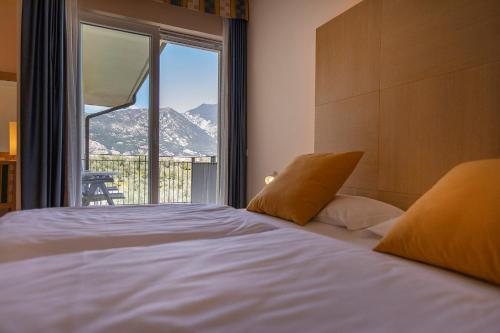Postel nebo postele na pokoji v ubytování Hotel Garnì Orchidea