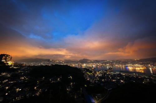 a view of a city at night at Garden Terrace Nagasaki Hotels & Resorts in Nagasaki