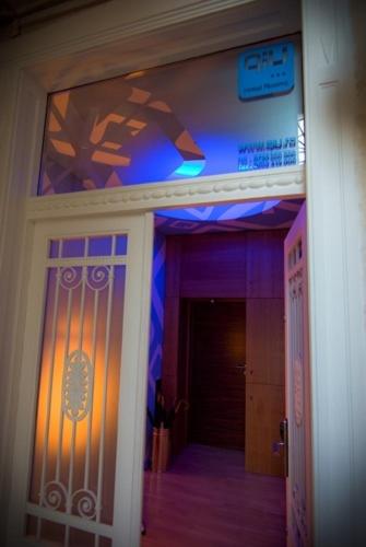 a entrance to a building with a blue and purple at Ivana Hotel in Oradea