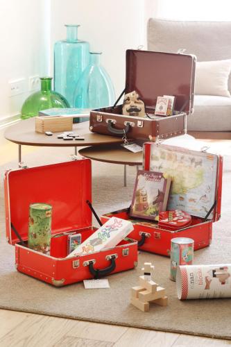 two open suitcases sitting on the floor in a living room at Ciutat de Girona in Girona