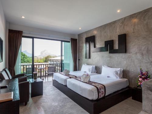 Postelja oz. postelje v sobi nastanitve Aonang Viva Resort - SHA Plus