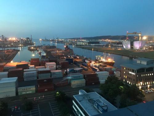 a view of a city with a harbor at night at James Clow Bed & Breakfast in Belfast