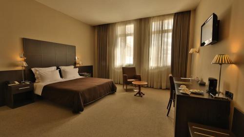 Katil atau katil-katil dalam bilik di TANA Hotel