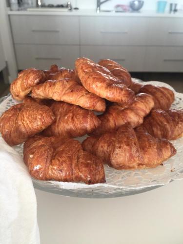 a pile of croissants on a plate on a table at Casa Boquera in Carche