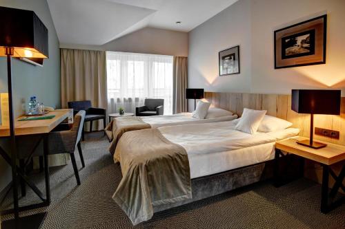 Posteľ alebo postele v izbe v ubytovaní Hotel Wojciech