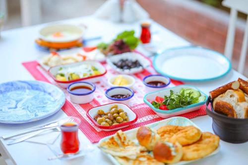 a table topped with plates and bowls of food at Dantel Butik Ev Pansiyon in Kas