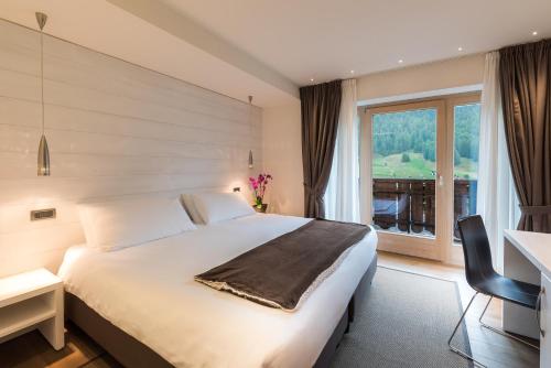 Postel nebo postele na pokoji v ubytování Hotel Astoria