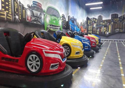 a row of cars parked in a parking garage at Euphoria Apartments in Batumi