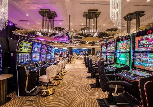 a casino with a bunch of slot machines at Euphoria Apartments in Batumi