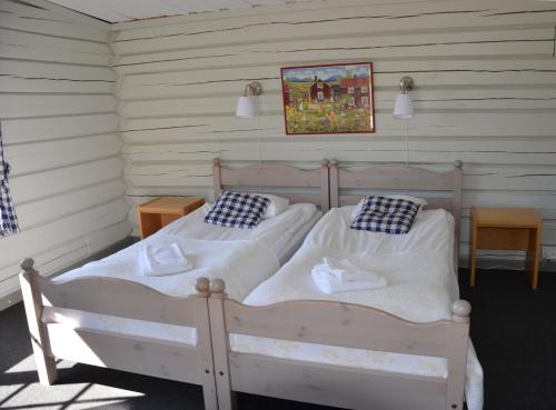 Säng eller sängar i ett rum på Dala Wärdshus