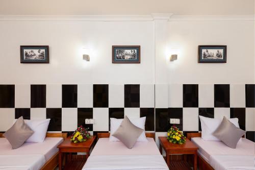 Ένα ή περισσότερα κρεβάτια σε δωμάτιο στο Botoum Hostel
