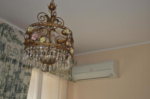 a chandelier hanging from a ceiling in a room at Villa L'Aurora in Pescara