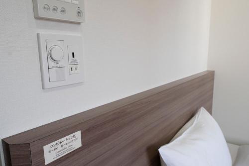 a headboard of a bed in a hotel room at Washington R&B Hotel Hakata Ekimae 2 in Fukuoka