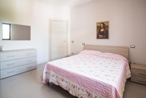 Casa Vacanza Dal Cavaliere tesisinde bir odada yatak veya yataklar