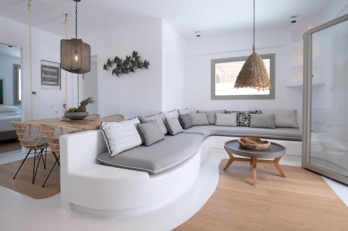 a living room with a couch and a table at Potami Home by Rocks Estates in Naousa