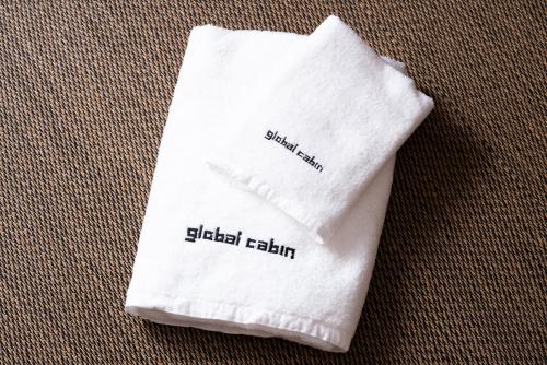 a white napkin with the word slaid ishtar written on it at global cabin Yokohama Chinatown in Yokohama